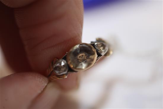 An 18th century gold, Stuart Crystal and diamond set mourning skull ring, size J approx.